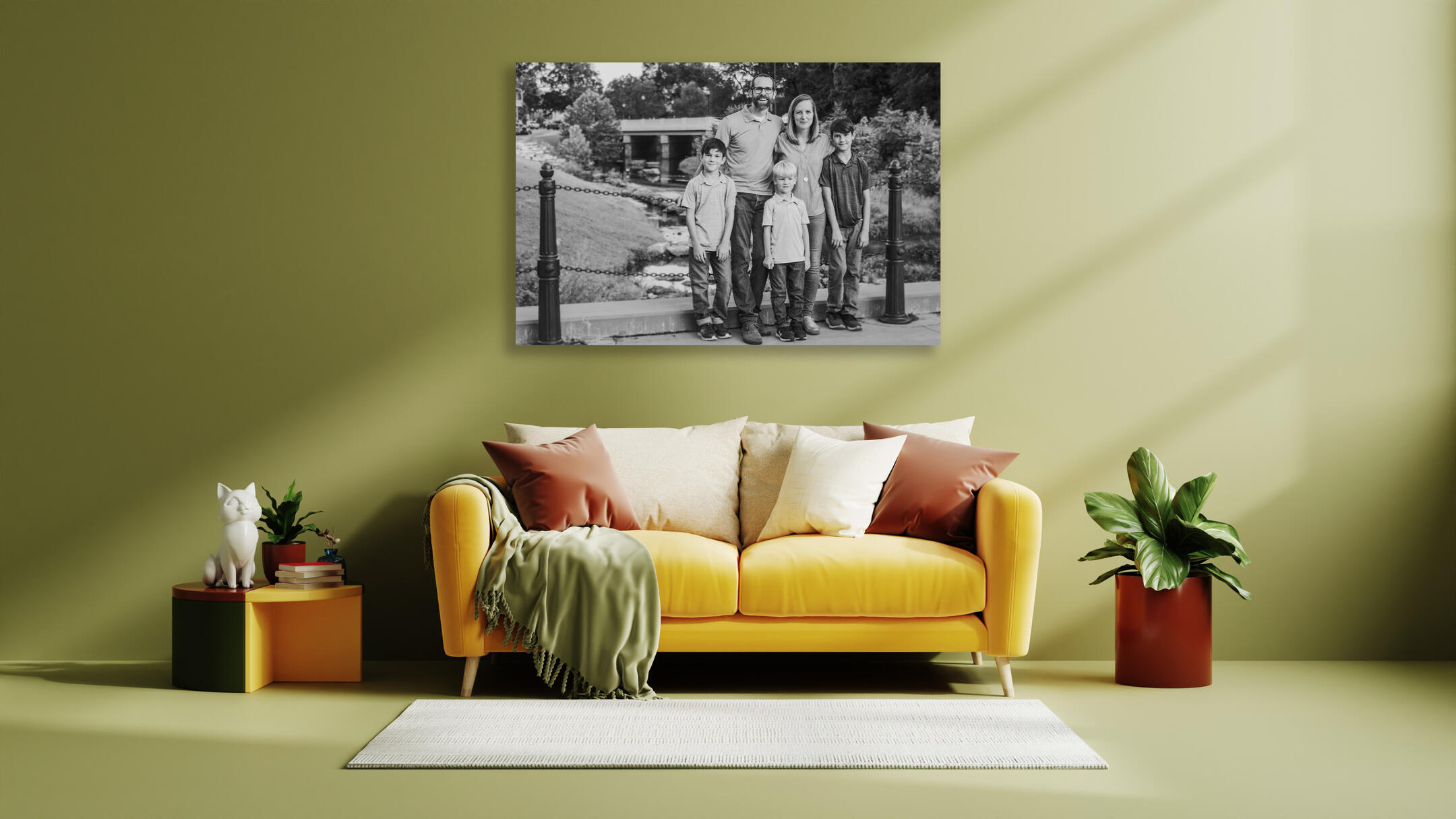 A framed Unspoken Art family photo hangs on the wall of an upscale living room in the Capital Region